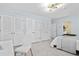 Serene bedroom with built-in storage, workspace, and a peaceful view of the outdoors at 424 Cezanne Dr, Osprey, FL 34229