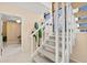 Bright view of the carpeted stairs leading to the main level and an interior view at 424 Cezanne Dr, Osprey, FL 34229