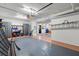 The expansive garage features epoxy floors and cabinets, offering ample storage space for vehicles and equipment at 424 Cezanne Dr, Osprey, FL 34229