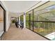 Screened hallway with beautiful views of the outdoors and access to other rooms at 424 Cezanne Dr, Osprey, FL 34229