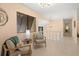 Bright hallway area featuring tile flooring, accent furniture and a large window at 424 Cezanne Dr, Osprey, FL 34229