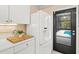 Kitchen featuring modern white appliances and a view of the pool at 424 Cezanne Dr, Osprey, FL 34229