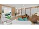 Inviting living room featuring comfortable seating and views into the breakfast nook at 424 Cezanne Dr, Osprey, FL 34229