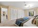 Spacious main bedroom with large closets and carpet flooring at 424 Cezanne Dr, Osprey, FL 34229