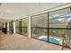 Enclosed patio showcasing a beautiful pool view, offering a serene outdoor retreat with ample natural light at 424 Cezanne Dr, Osprey, FL 34229