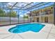 Relax by the screened-in pool, a private oasis perfect for cooling off on warm days with an outdoor shower nearby at 424 Cezanne Dr, Osprey, FL 34229