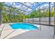 Bask in the sun by the screened-in pool surrounded by lush tropical landscaping, a perfect retreat for leisure and enjoyment at 424 Cezanne Dr, Osprey, FL 34229