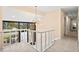 Bright hallway with large windows and unique hanging light fixture at 424 Cezanne Dr, Osprey, FL 34229