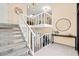 Bright, carpeted staircase featuring white railings and neutral walls at 424 Cezanne Dr, Osprey, FL 34229