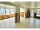 Spacious open-concept living room featuring tile floors, natural light, and potential for a modern design at 531 Edlee Ln, Longboat Key, FL 34228