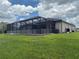 Spacious backyard featuring a screened lanai, perfect for outdoor living and entertaining at 6614 162Nd E Pl, Parrish, FL 34219