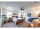 Spacious bedroom boasting lots of light, a comfy chair, and tasteful decor at 6614 162Nd E Pl, Parrish, FL 34219