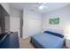 Relaxing bedroom showcasing a plush bed, closet, and white doors at 6614 162Nd E Pl, Parrish, FL 34219