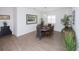 Inviting dining room featuring a dining table, chairs, decorative plants and a modern light fixture at 6614 162Nd E Pl, Parrish, FL 34219