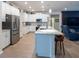 Modern kitchen featuring white cabinets, stainless steel appliances, a central island, and an open layout at 6614 162Nd E Pl, Parrish, FL 34219