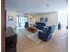 Open concept living area with lots of seating and view of pool area beyond sliding glass doors at 6614 162Nd E Pl, Parrish, FL 34219