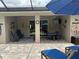 Outdoor patio space with ample seating, ceiling fan, and TV at 6614 162Nd E Pl, Parrish, FL 34219