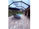 Relaxing screened-in pool with lounge chairs and a vibrant blue umbrella, ideal for enjoying sunny days at 6614 162Nd E Pl, Parrish, FL 34219