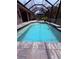 Gorgeous screened-in pool with sparkling blue water and inviting patio area, great for outdoor fun at 6614 162Nd E Pl, Parrish, FL 34219