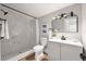 Modern bathroom featuring a white marble tiled shower with sleek black hardware at 1010 E Lake Ave, Tampa, FL 33605