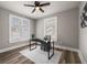 Bedroom featuring a ceiling fan, neutral walls, updated light fixture, wood-look flooring, and great light at 1010 E Lake Ave, Tampa, FL 33605