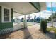 View of covered front porch with white columns and steps, enhancing the curb appeal at 1010 E Lake Ave, Tampa, FL 33605