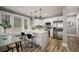 Contemporary kitchen with stainless steel appliances, quartz countertops, and stylish bar seating at 1010 E Lake Ave, Tampa, FL 33605
