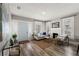 Cozy living room features a decorative fireplace, neutral color palette, and lots of natural light at 1010 E Lake Ave, Tampa, FL 33605