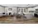 Bright living space with open layout to the kitchen, showcasing modern design and ample natural light at 1010 E Lake Ave, Tampa, FL 33605