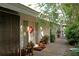 Charming home exterior featuring a welcoming walkway lined with potted plants and greenery at 3721 Flamingo Ave, Sarasota, FL 34242