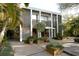 Stunning two-story modern home with meticulous landscaping, a patio, and unique architectural details at 3721 Flamingo Ave, Sarasota, FL 34242