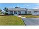 Inviting single-story villa showcasing a well-maintained lawn and walkway to the front door at 3701 39Th W St, Bradenton, FL 34205