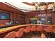 Well-appointed bar area with premium seating, full bar, and flat screen TVs at 4221 Escondito Cir, Sarasota, FL 34238