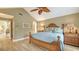 Spacious bedroom with a high ceiling, light colored walls, and wood floors at 4221 Escondito Cir, Sarasota, FL 34238