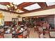 Spacious dining room with comfortable seating, dark wood features and decorative lighting at 4221 Escondito Cir, Sarasota, FL 34238