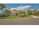 Attractive single-story home with a clay tile roof, mature landscaping, and a spacious driveway at 4221 Escondito Cir, Sarasota, FL 34238