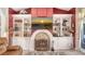 Stylish fireplace with decorative tile surround and built-in bookshelves on either side at 4221 Escondito Cir, Sarasota, FL 34238