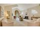 Bright living room showcasing a fireplace, vaulted ceilings, and large windows with decorative curtains at 4221 Escondito Cir, Sarasota, FL 34238