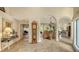 Open-concept living area with a view of the pool, high ceilings, and marble floors at 4221 Escondito Cir, Sarasota, FL 34238