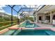 A luxurious in-ground pool, and spa offer the ultimate outdoor experience with stunning water views at 4221 Escondito Cir, Sarasota, FL 34238