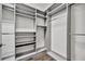 Walk-in closet boasts custom shelving and ample hanging space for organization and storage at 5607 Tidewater Preserve Blvd, Bradenton, FL 34208