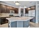 Modern kitchen features stainless steel appliances, sleek cabinets, and a stylish tile backsplash at 5607 Tidewater Preserve Blvd, Bradenton, FL 34208
