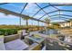 Outdoor fire pit with pool and seating area, ideal for entertaining guests or lounging at 5607 Tidewater Preserve Blvd, Bradenton, FL 34208
