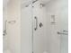 Modern bathroom featuring a glass-enclosed shower and grab bars for accessibility at 5724 Doral Dr, Sarasota, FL 34243