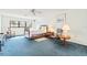 Spacious bedroom with natural light, ceiling fan, and classic wooden furniture at 5724 Doral Dr, Sarasota, FL 34243
