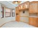 Bright dining area with tile floors, built in cabinets, and views to the front yard at 5724 Doral Dr, Sarasota, FL 34243