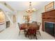 Charming dining room with a wood table, fireplace and staircase at 5724 Doral Dr, Sarasota, FL 34243