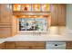 Kitchen view through the bar, with a white countertop and stainless steel appliances at 5724 Doral Dr, Sarasota, FL 34243