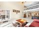 Spacious living room with a high ceiling, open layout, and access to a balcony at 5724 Doral Dr, Sarasota, FL 34243