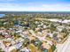 This aerial shot showcases a tranquil community with waterfront homes, green spaces, and convenient road access at 7507 3Rd Nw Ave, Bradenton, FL 34209
